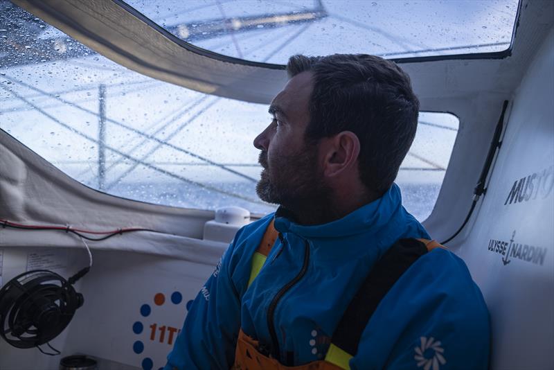 The Ocean Race 2022-23 Leg 3 onboard 11th Hour Racing Team. Charlie Enright in the leeward bubble checking the triune of the jib - photo © Amory Ross / 11th Hour Racing / The Ocean Race