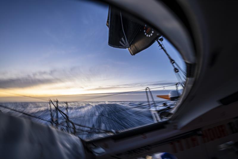 The Ocean Race 2022-23 Leg 3 onboard 11th Hour Racing Team. Sunset through the aft hatch photo copyright Amory Ross / 11th Hour Racing / The Ocean Race taken at  and featuring the IMOCA class