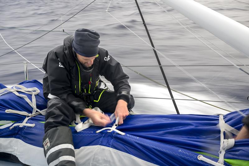 The Ocean Race 2022-23 Leg 3 onboard Biotherm. Skipper Paul Meilhat packing a sail in its bag - photo © Ronan Gladu / Biotherm / The Ocean Race