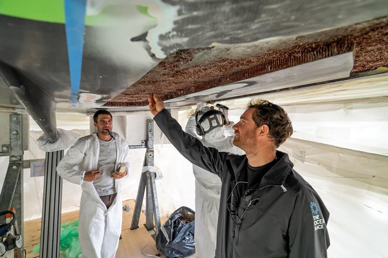 The Ocean Race 2022-23 - 4 March , Leg 3. GUYOT environnement - Team Europe skipper Benjamin Dutreux works on the hull repair replacing the Nomex material photo copyright Charles Drapeau / Guyot environnement - Team Europe taken at  and featuring the IMOCA class