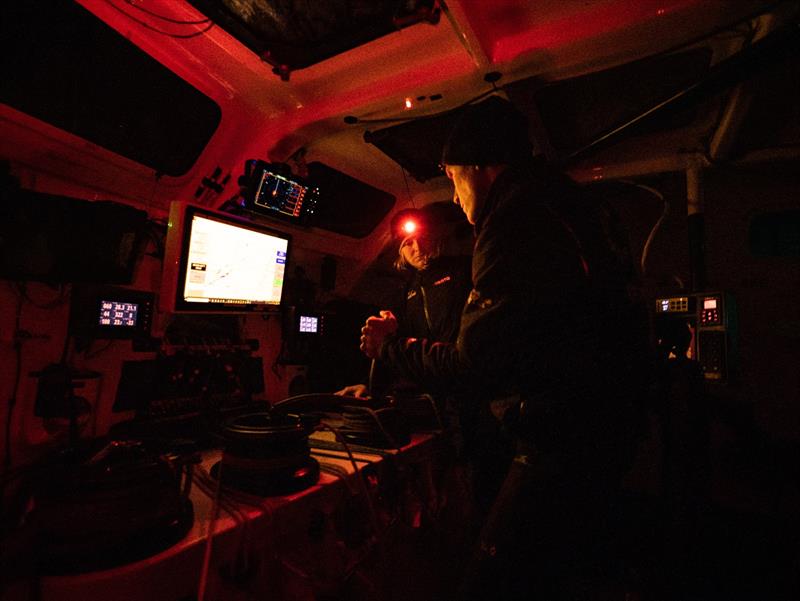 The Ocean Race 2022-23 - 24 May 2023, Leg 5, Day 3 onboard Team Malizia. Rosalin Kuiper and Will Harris discussing checking the settings in the computer photo copyright Antoine Auriol / Team Malizia / The Ocean Race taken at  and featuring the IMOCA class