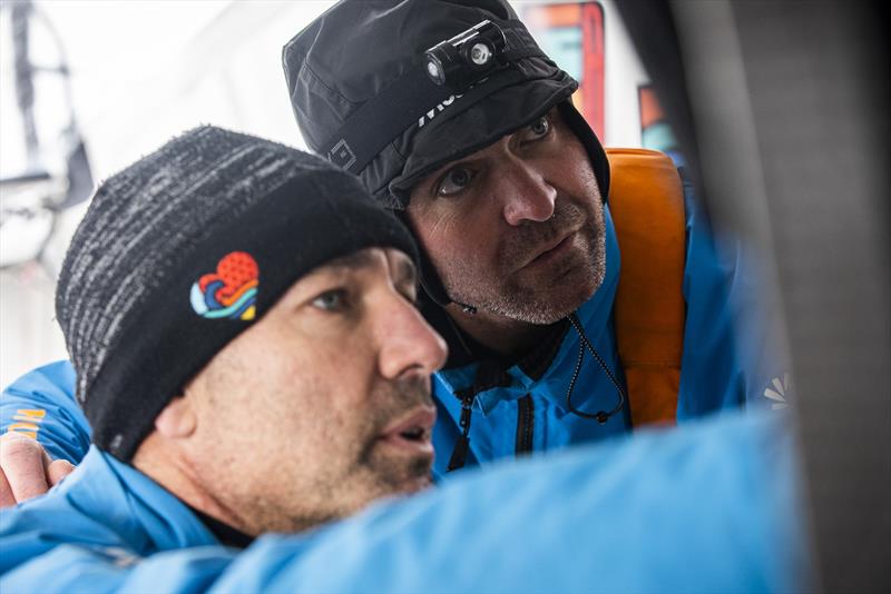 The Ocean Race 2022-23 - May 24, Leg 5 Day 3 onboard 11th Hour Racing Team . Malama enjoying flatter, calmer seas in the North Atlantic. Charlie Enright and Simon Fisher work through the options with a download of new weather information photo copyright Amory Ross / 11th Hour Racing / The Ocean Race taken at  and featuring the IMOCA class