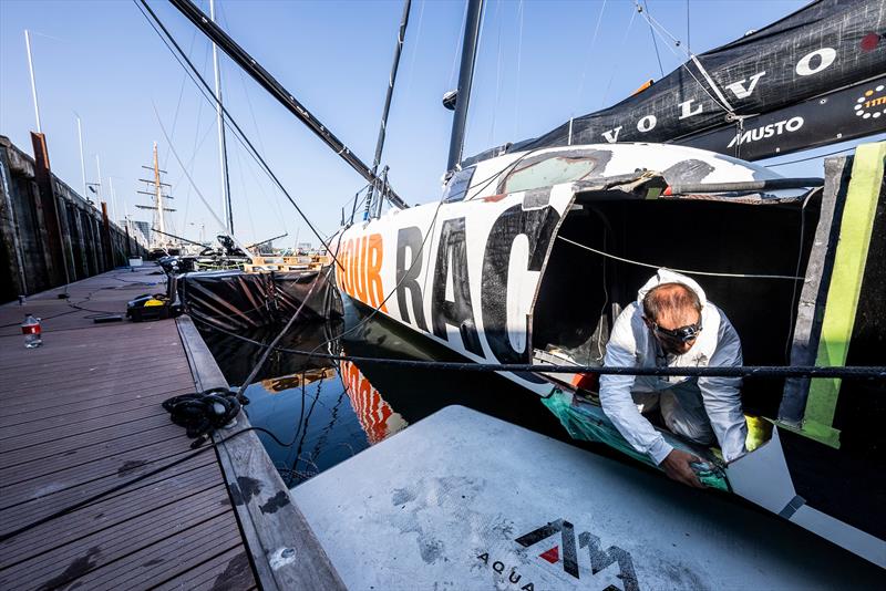 The 11th Hour Racing Team continues repairs after a collision during the start of Leg 7 photo copyright Amory Ross / 11th Hour Racing Team taken at New York Yacht Club and featuring the IMOCA class