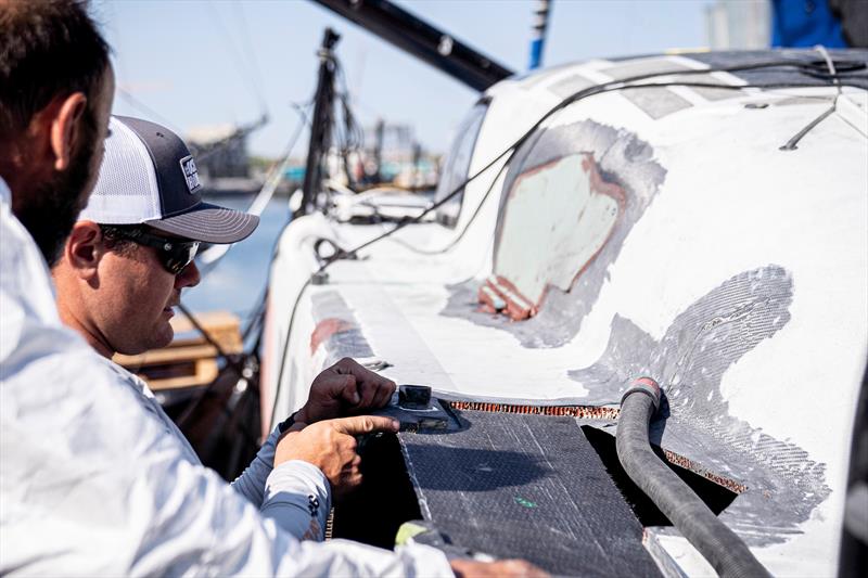 The 11th Hour Racing Team continues repairs after a collision during the start of Leg 7 photo copyright Amory Ross / 11th Hour Racing Team taken at New York Yacht Club and featuring the IMOCA class