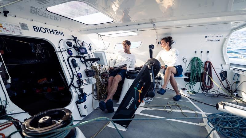 The Ocean Race 2022-23 - 18 June 2023, Leg 7, Day 3 onboard Biotherm. Skipper Paul Meilhat and Mariana Lobato checking the last positions reports - photo © Anne Beauge / Biotherm / The Ocean Race