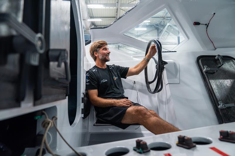Boris Herrmann sitting in the cockpit of his new IMOCA race yacht which features steering wheels instead of a tiller photo copyright Flore Hartout / Team Malizia taken at  and featuring the IMOCA class