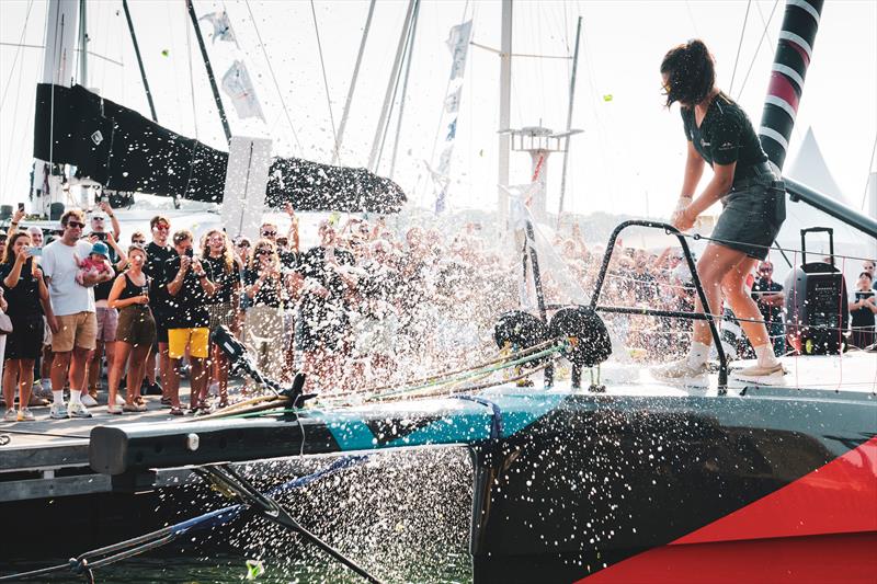 Cole Brauer smashed the bottle on the anker of the boat, successfully christening Malizia 4 - photo © Eloi Stichelbaut | polaRYSE | Team Malizia