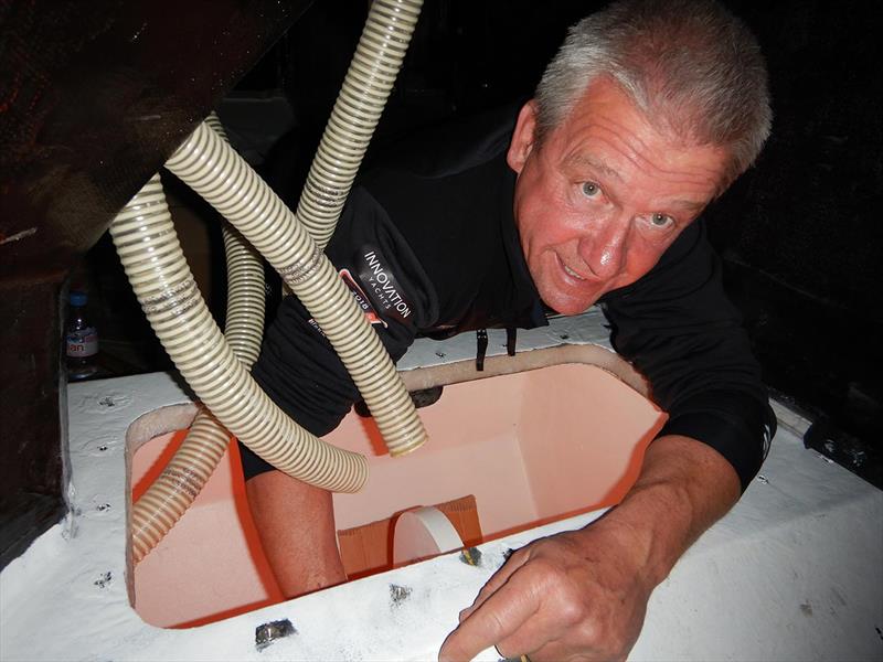Norbert working in keel compartment of Open60AAL photo copyright Innovation Yachts taken at  and featuring the IMOCA class