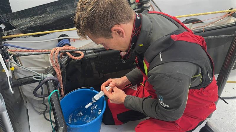 The Ocean Race 2022-23 - Leg 3, Day 25 onboard Team Malizia. Will Harris picks up water sample from this remote part of the Ocean between Point Nemo and Cape Horn - photo © Antoine Auriol / Team Malizia / The Ocean Race