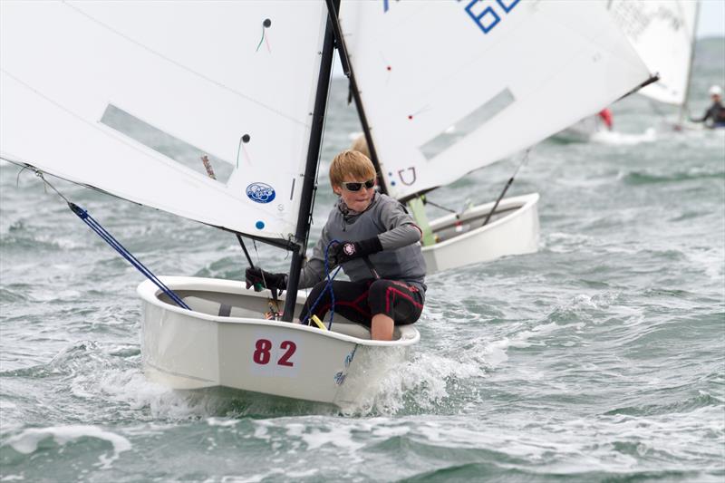 Irish sailor Daniel Hopkins (IRL 1450) competing in the second day of the Optimist European Championships on Dublin Bay photo copyright Gareth Craig / www.fotosail.com taken at Royal St George Yacht Club and featuring the Optimist class