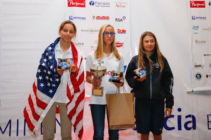 2014 Optimist World Championship girls' podium (l to r) 2nd Emma Kaneti (USA), 1st Aina Colom (SPN) & 3rd Mara Turin (SLO) photo copyright Matias Capizzano / www.capizzano.com taken at Club Náutico San Isidro and featuring the Optimist class