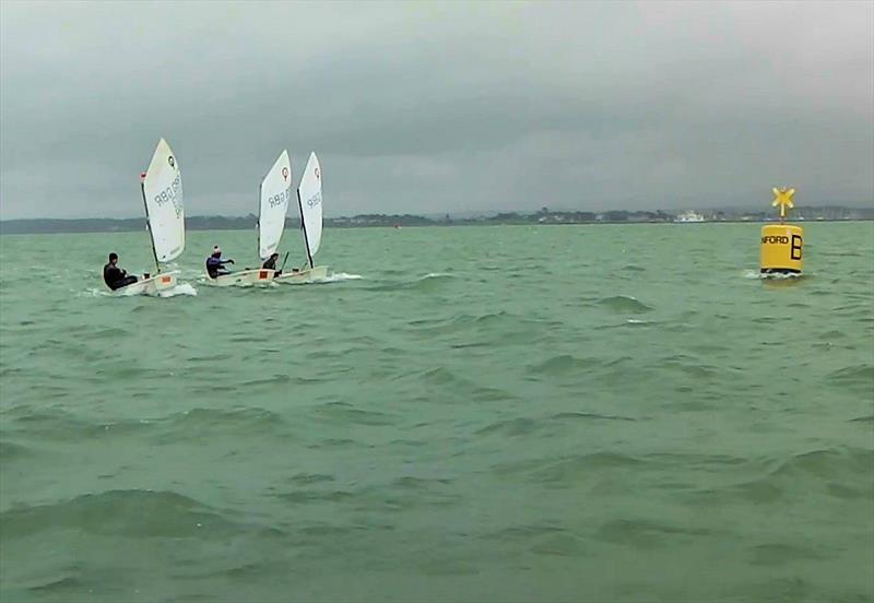 At the finish line - Three Optimist sailors break the record for sailing round the Isle of Wight photo copyright Tim Davies / Mark Lance taken at Bewl Sailing Association and featuring the Optimist class