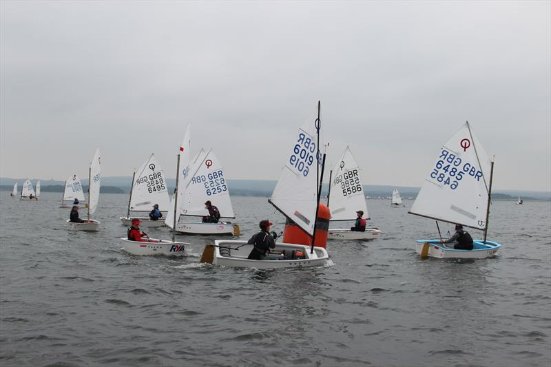 Main fleet windward mark rounding during the Parkstone Optimist Open photo copyright Rob McCormick taken at Parkstone Yacht Club and featuring the Optimist class