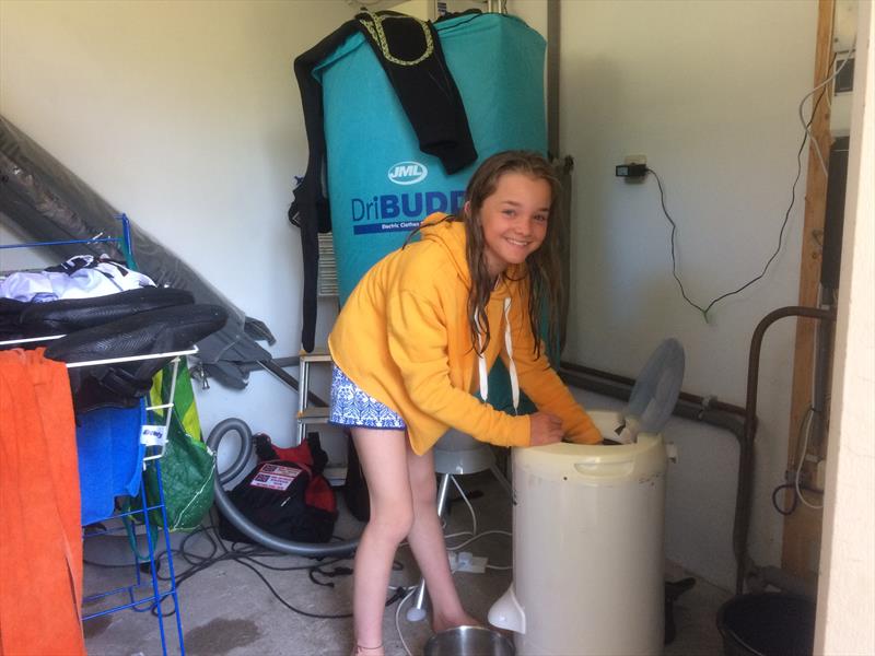 Freya Sewell, the youngest girl in the team, at the 'laundrette' during the Optimist Europeans 2018 photo copyright Valeria Sesto taken at Jachtclub Scheveningen and featuring the Optimist class