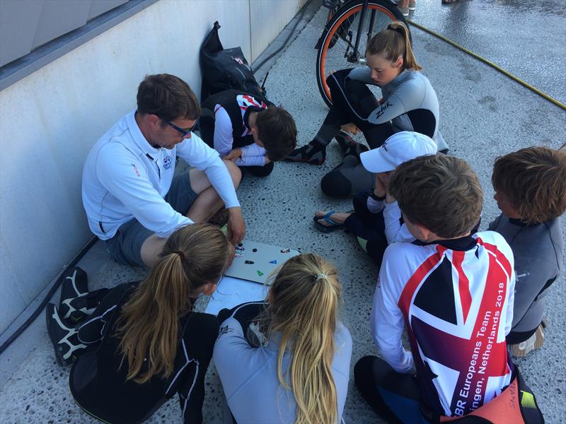 Keeping the focus while waiting ashore during the Optimist Europeans 2018 photo copyright Valeria Sesto taken at Jachtclub Scheveningen and featuring the Optimist class