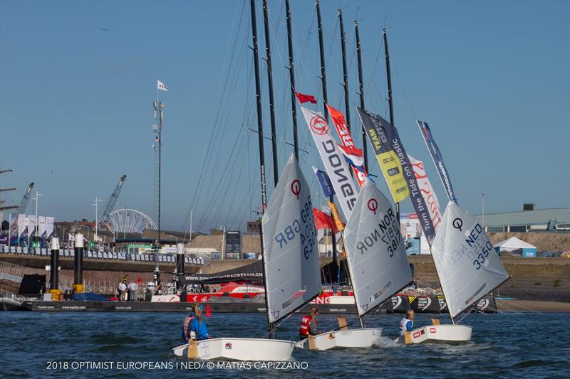 Emily Mueller and other top female Sailors heading back by the Volvo Ocean Race Village at the Optimist Europeans 2018 photo copyright Matias Capizzano taken at Jachtclub Scheveningen and featuring the Optimist class