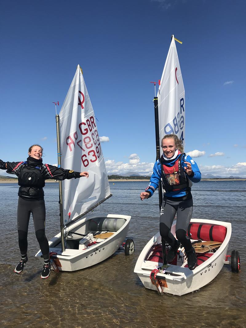 Emily Mueller and Flo Brellisford, coming ashore after their last Optimist event. They are moving on to sail a 29er together after the Volvo Gill Optimist British Nationals photo copyright Andy Green / www.greenseaphotography.co.uk taken at Plas Heli Welsh National Sailing Academy and featuring the Optimist class