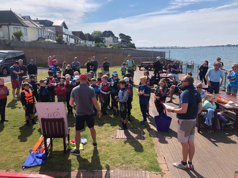 Parkstone Optimist Open Regatta fleet brieing with RO Roger Hakes photo copyright Elaine Hakes taken at Parkstone Yacht Club and featuring the Optimist class