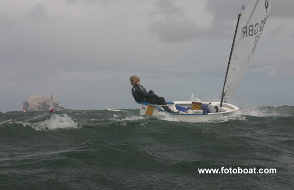 Jamie Calder sails under a threatening sky photo copyright Alan Henderson / www.fotoboat.com taken at East Lothian Yacht Club and featuring the Optimist class