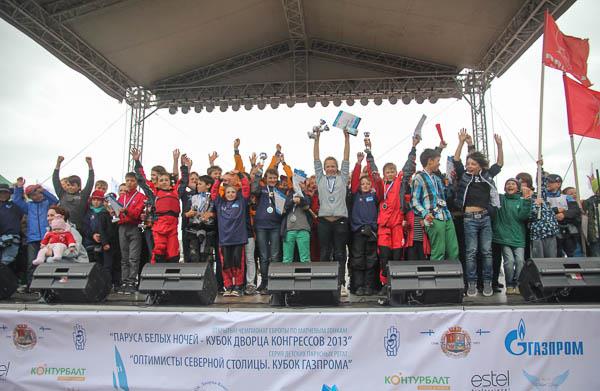 Over 50 competitors celebrate at the first stage prize giving of The Optimists of the Northern Capital, The Gazprom Cup photo copyright SPBYC taken at Yacht Club of Saint-Petersburg and featuring the Optimist class