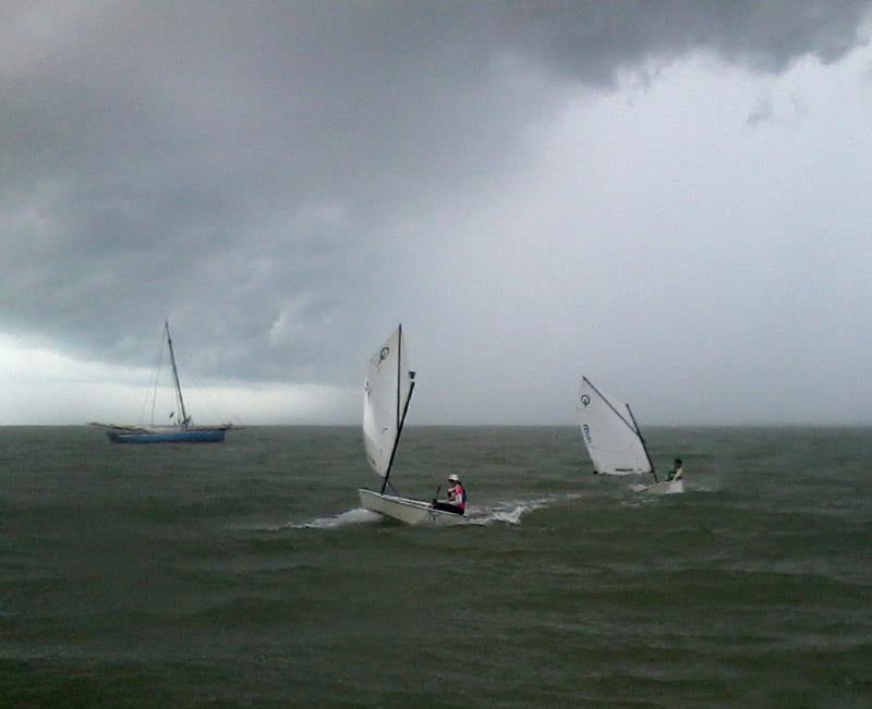 Even in the Caribbean weather conditions can change suddenly photo copyright George Tomlin taken at Belize Sailing Association and featuring the Optimist class