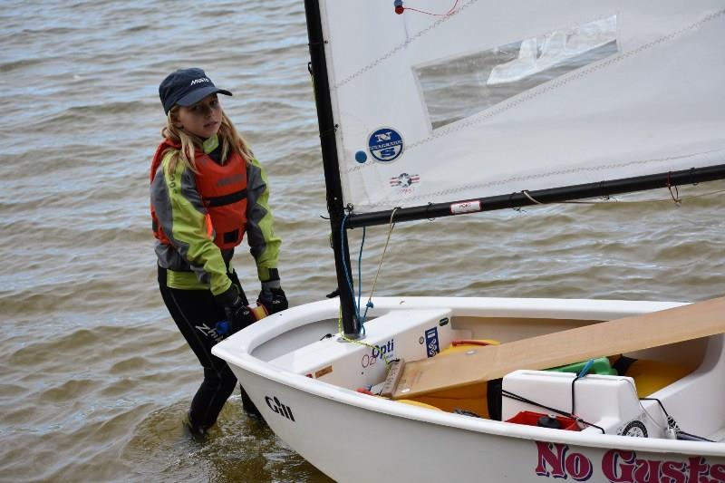 Kelly Steele launches her boat for the afternoon session photo copyright Jet Mallinson taken at  and featuring the Optimist class
