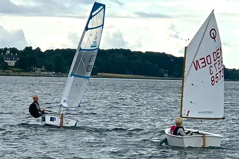 The additional power in the O-Pro rig is apparent in this shot photo copyright O-Pro taken at  and featuring the Optimist class