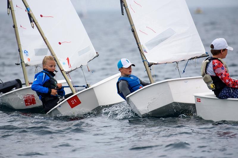 A tight squeeze competitors squeeze in on starboard during the AIB Irish Optimost Championship at the Royal Cork Yacht Club - photo © Bob Bateman
