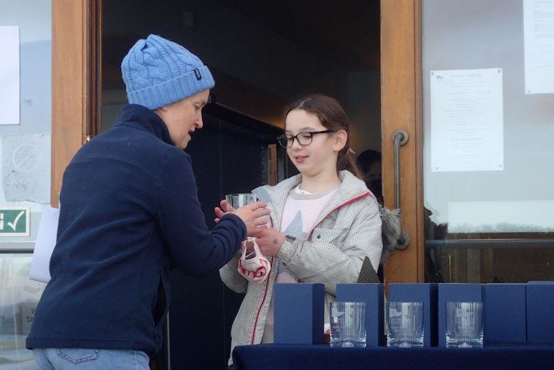Emilia Davies wins a prize for determination and calm in the Chichester Frozen Toe Series photo copyright Mark Green taken at Chichester Yacht Club and featuring the Optimist class