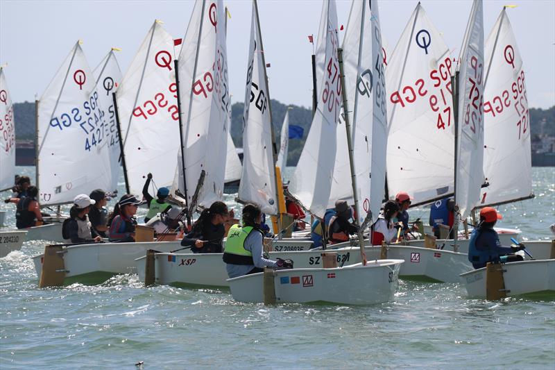 The competitors grouping up and getting ready for their next race - Raffles Marina Optimist Regatta 2022 - photo © Raffles Marina