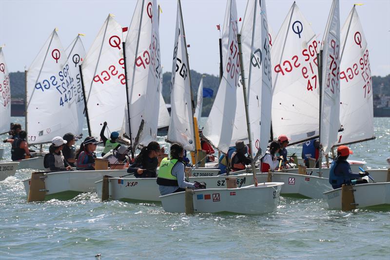 The competitors grouping up and getting ready for their next race - Raffles Marina Optimist Regatta 2022 - photo © Raffles Marina