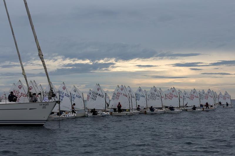 Phuket King's Cup 2022: Optimist start in fading light photo copyright Guy Nowell / Phuket King's Cup taken at Phuket Yacht Club and featuring the Optimist class