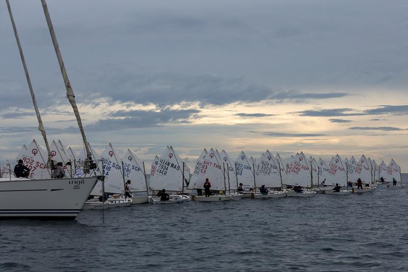 Phuket King's Cup 2022: Optimist start in fading light photo copyright Guy Nowell / Phuket King's Cup taken at Phuket Yacht Club and featuring the Optimist class