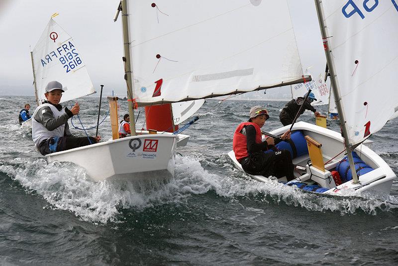 34th Palamós Optimist Trophy day 1 - Winds higher at the start of the day photo copyright Alfred Farré taken at Club de Vela Palamos and featuring the Optimist class