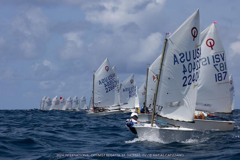 The USA's Grant Chin leads the pack at the 2024 International Optimist Regatta photo copyright Matias Capizzano taken at St. Thomas Yacht Club and featuring the Optimist class