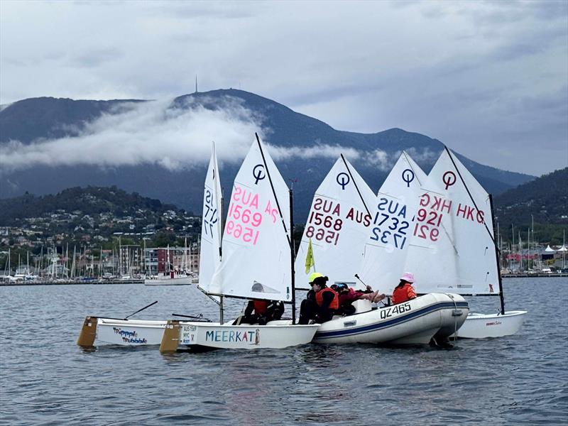 A group of Victorian Optimist sailors planning tactics with their on-water coaches - 2026 Musto Australian Optimist Dinghy Championship photo copyright Jane Austin taken at Royal Yacht Club of Tasmania and featuring the Optimist class