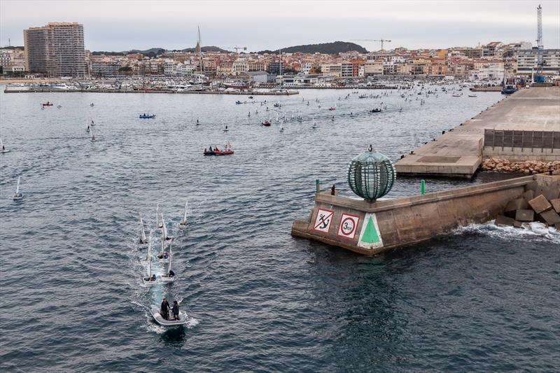 The 360 Optimist boats leaving the port of Palamós - photo © Oscar Torveo