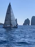 RAN 630 - The X-41 Adrigole II sailing with the Capri's Faraglioni in the background