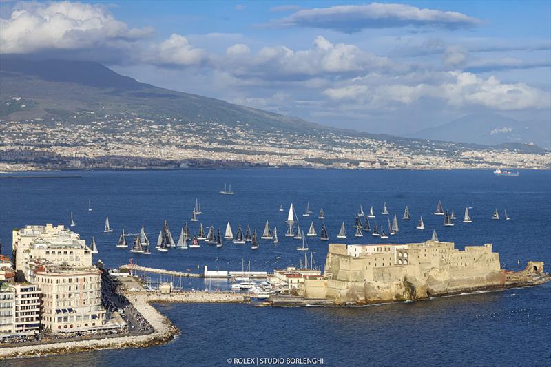 Last year's Regata dei Tre Golfi sets sail from off Santa Lucia. The infamous Mount Vesuvius is in the background photo copyright ROLEX / Studio Borlenghi taken at Circolo del Remo e della Vela Italia and featuring the ORC class