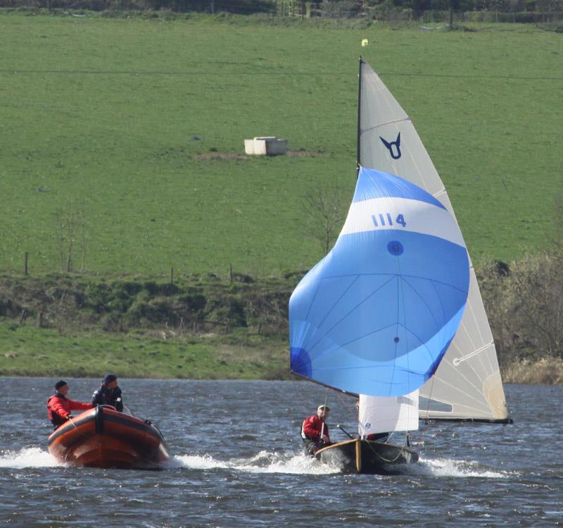 Ros and David Downs get tips on spinnaker setting from coach Tim Rush photo copyright Alan Henderson taken at  and featuring the Osprey class