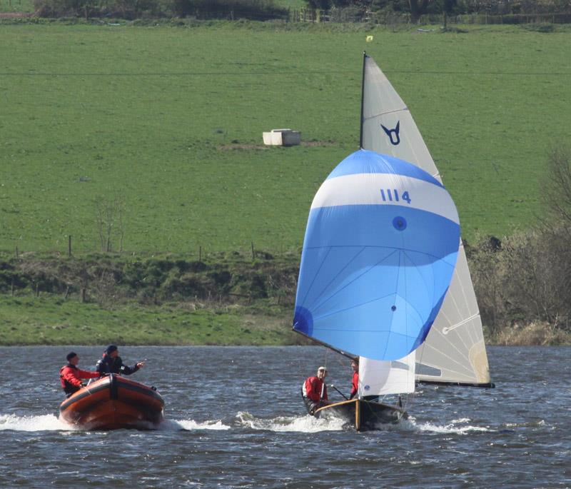 Ros and David Downs get tips on spinnaker setting from coach Tim Rush photo copyright Alan Henderson taken at  and featuring the Osprey class