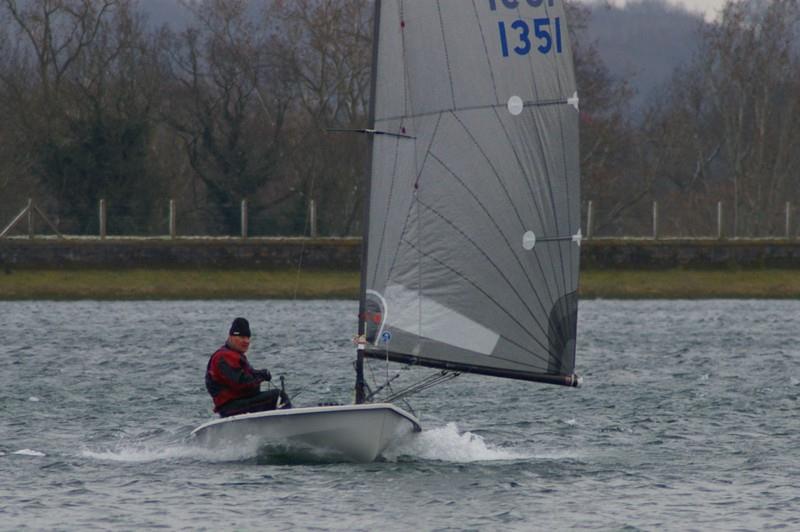 Another very cold and nicely breezy reach for John Oldham at the Island Barn Phantom Open photo copyright Jim Champ taken at Island Barn Reservoir Sailing Club and featuring the Phantom class