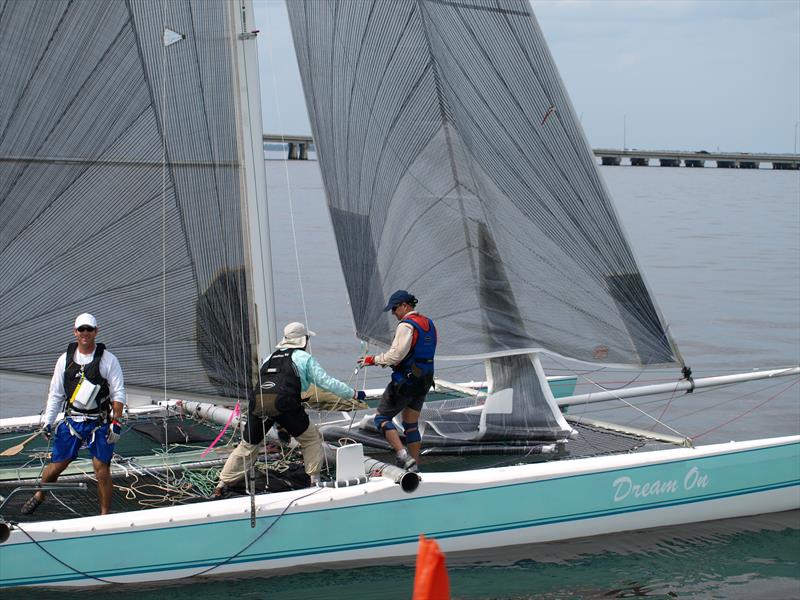 Eric Roberts, his father Bill Roberts in mid-crew position, and Dave Weir as foredeck, ghost across the line first in the 2008 race photo copyright The Mug Race taken at The Rudder Club of Jacksonville and featuring the PHRF class