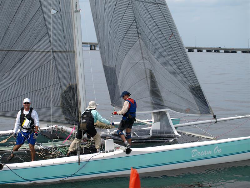 Eric Roberts, his father Bill Roberts in mid-crew position, and Dave Weir as foredeck, ghost across the line first in the 2008 race photo copyright The Mug Race taken at  and featuring the PHRF class