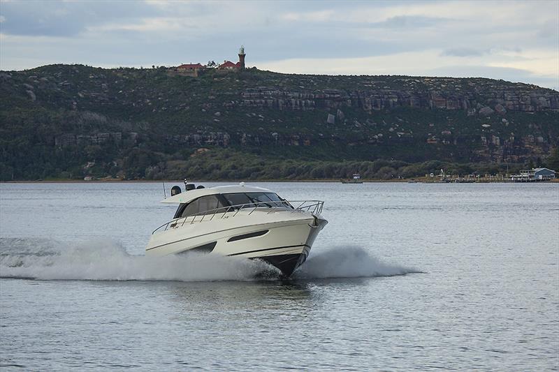 Charging back up Pittwater under the watchful eye of Barrenjoey Light. Flat water like this and the X50 will do 27 knots all day long photo copyright John Curnow taken at  and featuring the Power boat class