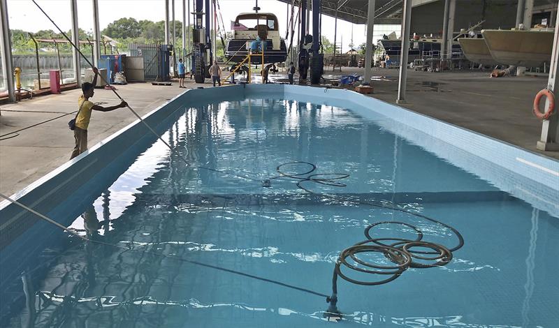 The pool guy - except this is the float tank for testing the boats at grand banks and shows how cleanliness is paramount to them - photo © John Curnow