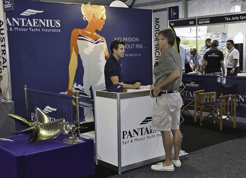 Pantaenius' Chris Tilley talking with a client at the Sanctuary Cove Boat Show photo copyright John Curnow taken at  and featuring the Power boat class