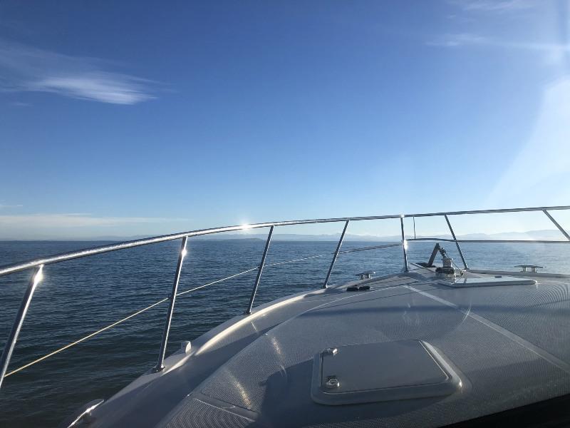 Isobar gleaming as she skims south along the North Island in her delivery crossing. - photo © Riviera Australia