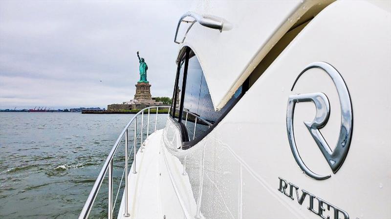 Hero Optm Being by the Statue of Liberty in New York City on his own boat was a bucket list item for Don and it marked the start of Dons trip home to Kenosha in Wisconsin photo copyright Riviera Australia taken at  and featuring the Power boat class