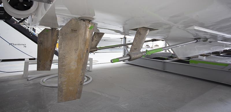 The keel, 13 degree deadrise, shallow shaft angle, offset, toe out rudders and the large stern thruster all visible as the Maritimo S75 takes shape in the factory - photo © John Curnow